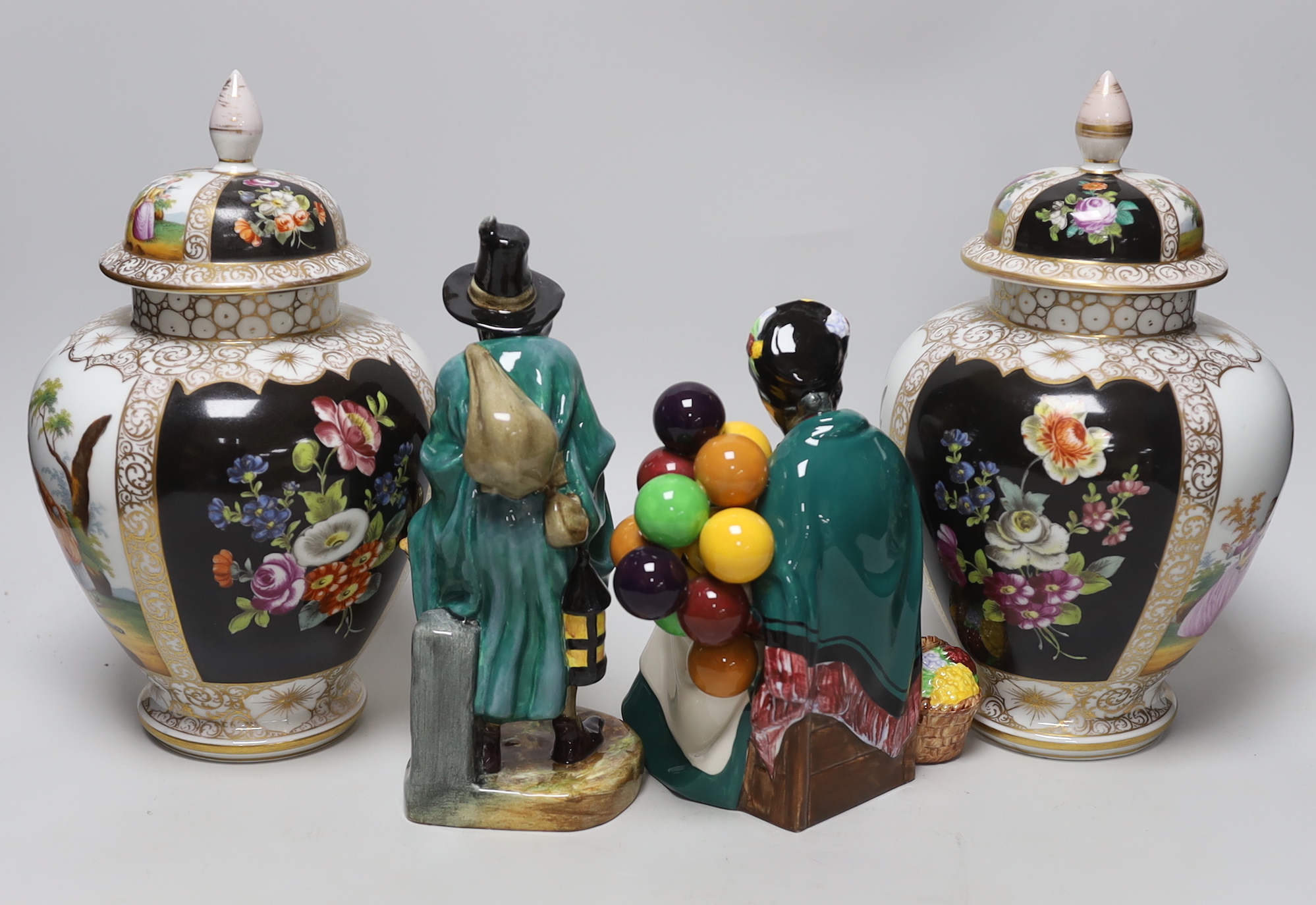 A pair of Dresden vases and covers and two Doulton figures, tallest 26cm